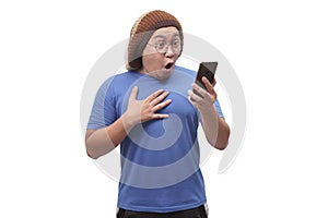 Young Man Texting Reading Chatting on His Phone Surprised Gesture
