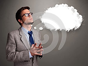 Young man thinking about cloud speech or thought bubble with cop