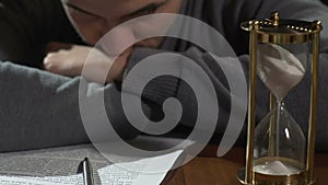 Young man thinking about signing document, starting new business, close-up