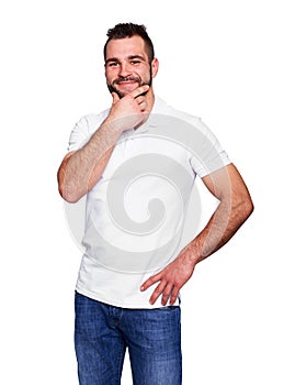 Young man thinking in a white polo shirt