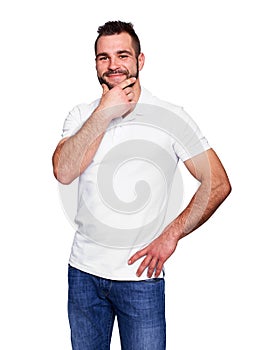 Young man thinking in a white polo shirt photo