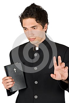 Young man thoughtful with bible and peace sign