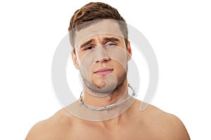 Young man with throat pain.