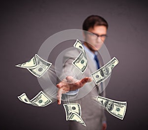 Young man throwing money
