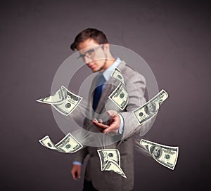 Young man throwing money