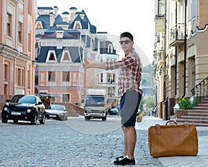 Young man thumbing a ride