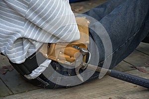 Young man with tool belt.