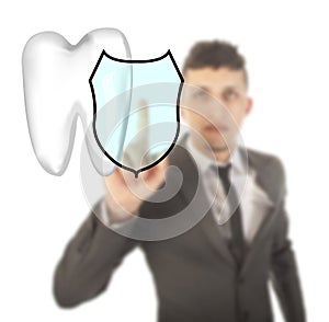 Young man with tooth shield symbol isolated