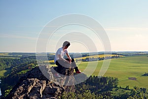 Young man on top of rock