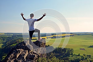 Young man on top of rock
