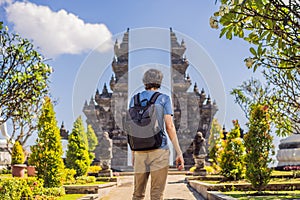 Young man tourist in budhist temple Brahma Vihara Arama Banjar Bali, Indonesia