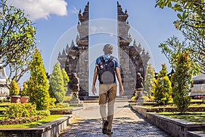 Young man tourist in budhist temple Brahma Vihara Arama Banjar Bali, Indonesia