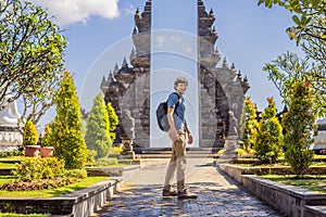 Young man tourist in budhist temple Brahma Vihara Arama Banjar Bali, Indonesia