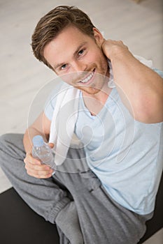 young man towelling off after exercising photo