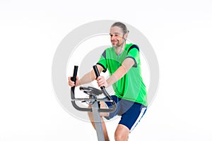 Young man train with fitness machine and listening music