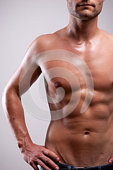 Young man trained topless with abs
