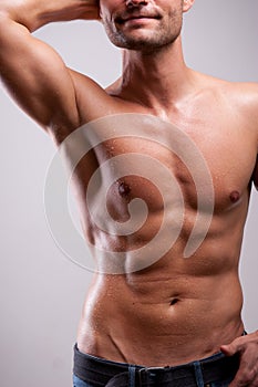 Young man trained topless with abs