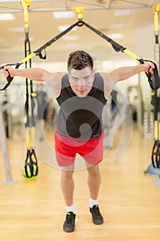 Young man training in gym