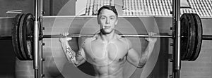 Young man training in smith machine