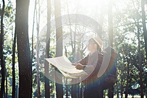 Young Man Traveler with backpack relaxing outdoor.