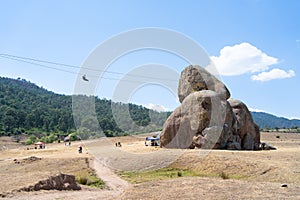 A young man travels on the zip line of the rocks of Tapalpa Jalisco Mexico. photo