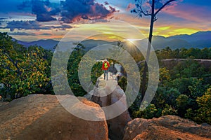 Young man trekking along Pai canyon in Mae hong son province, Thailand. Adventure, trekking and trail concept