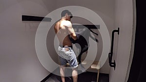 Young Man Trying on Clothes in Clothing Store