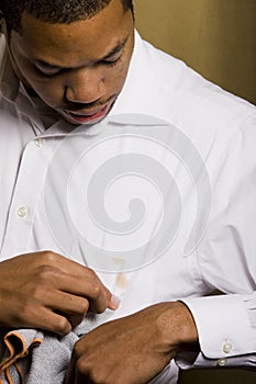 Young man trying to clean a stain