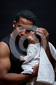 Young man trying to protect his insecure baby