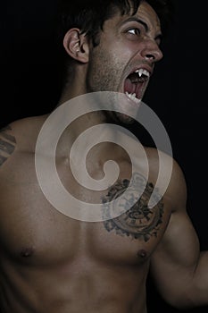 Young man turning into werewolf photo