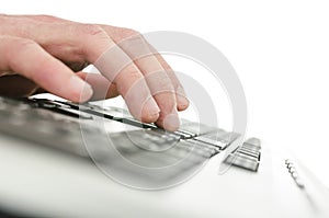 Young man typing on computer