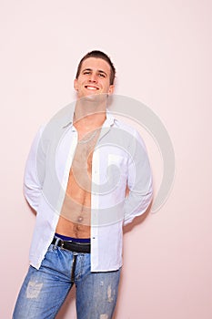 Young man with unbuttoned shirt