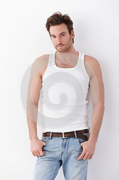 Young man in undershirt and jeans