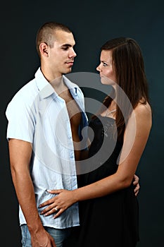 Young man with undone shirt and his girlfriend