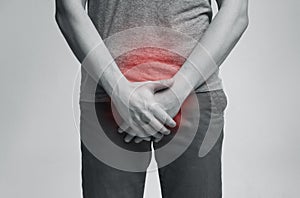 Young man with urological problems suffering from pain