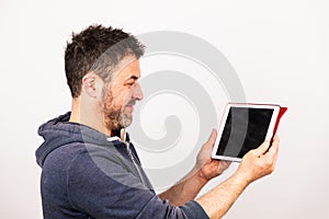 Young man uses a tablet