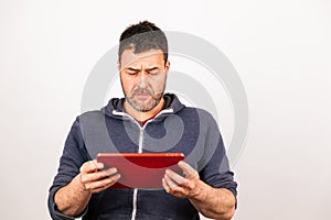Young man uses a tablet