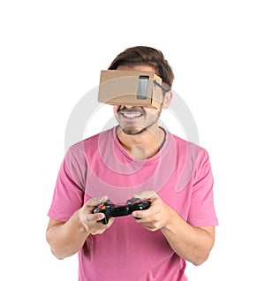 Young man using cardboard virtual reality headse