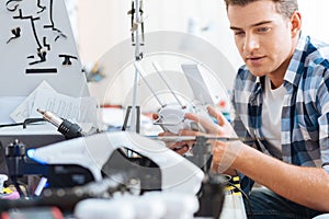 Young man using drone and remote controller