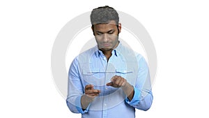 Young man using glass digital tablet.