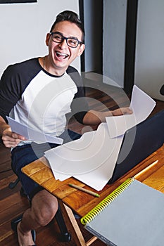 Young man using laptop and working from home