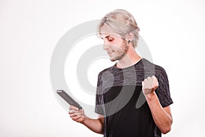 Young man using mobile phone texting on smartphone