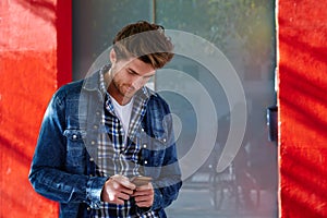 Young man using smartphone outdoor