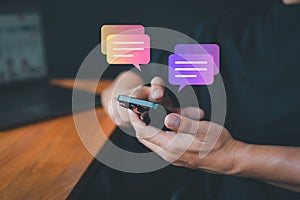 Young man using a smartphone with social media, typing live chat chatting on application