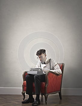 Young man using a typewriter