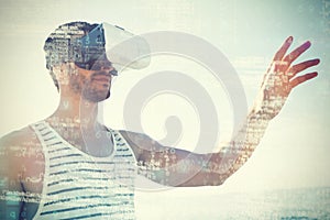 Young man using virtual reality 3d glasses at beach