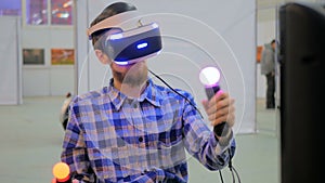 Young man using virtual reality glasses. VR photo
