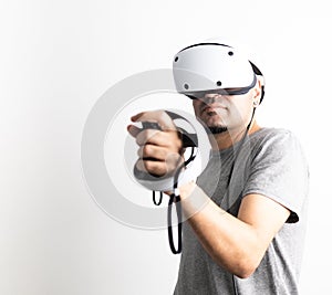 Young man using VR headset. Guy playing with VR glasses