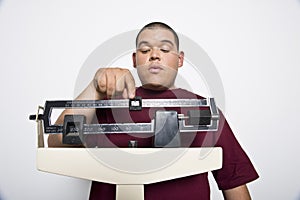 Young Man Using Weight Scales