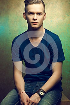 Young man with very handsome face in blue t-shirt